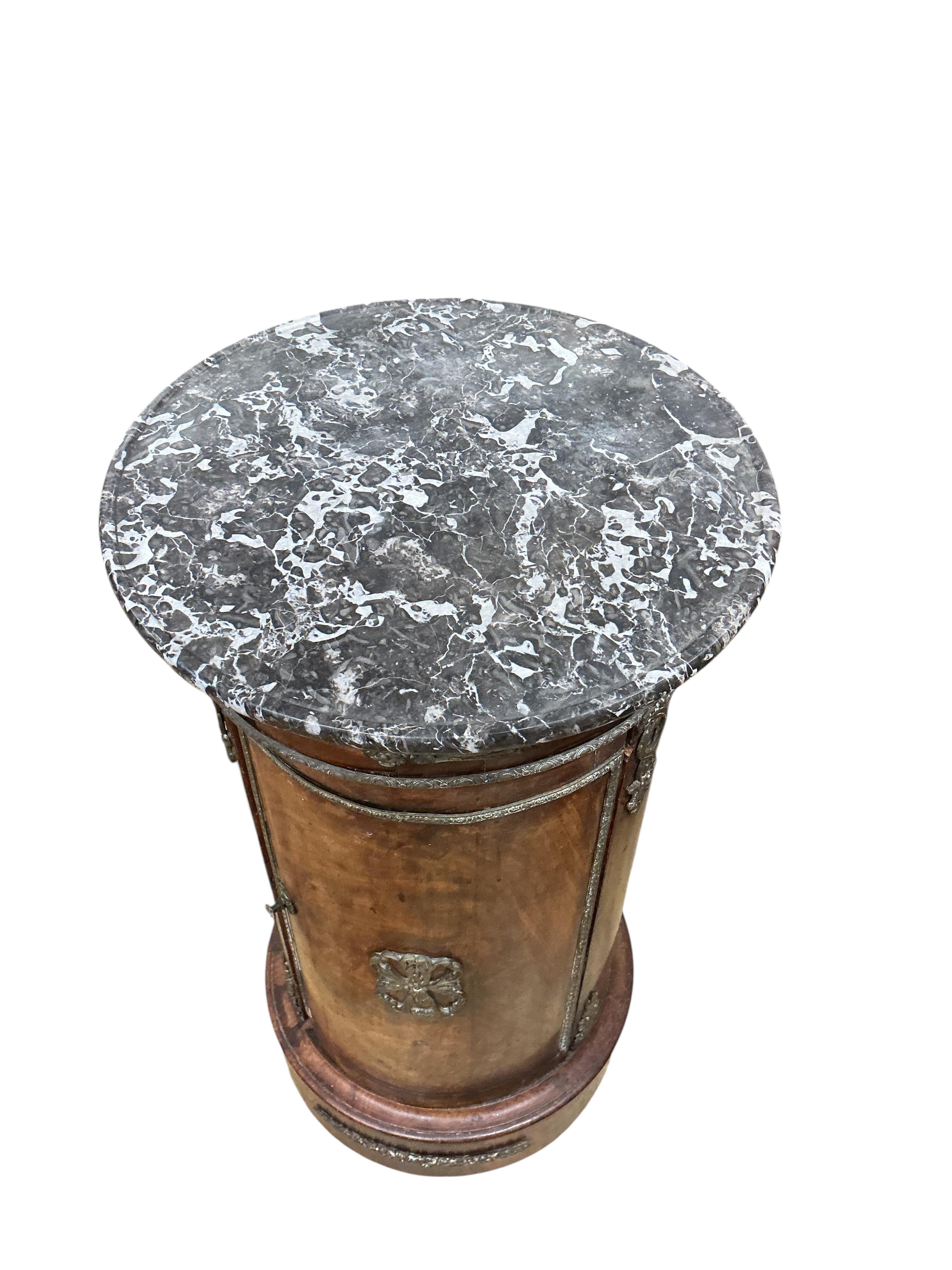 A 19th century French ormolu mounted mahogany cylindrical pot cupboard, with dished grey marble top, diameter 40cm, height 75cm